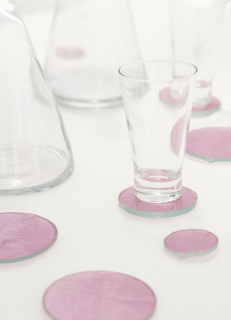 Empty glasses on coasters