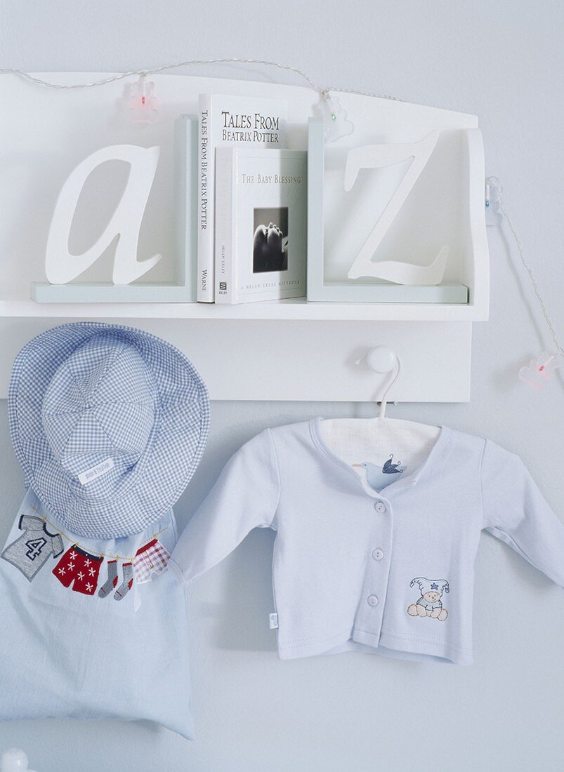 Child's clothing hanging from a shelf