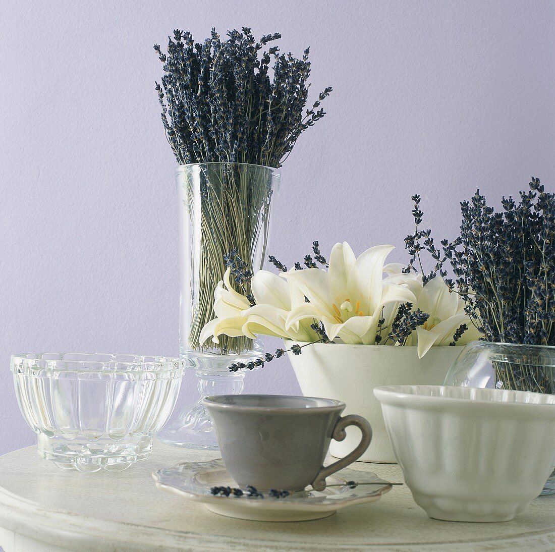 Flowers and cups on table