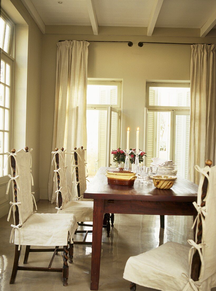 Dining table and chairs with loose covers