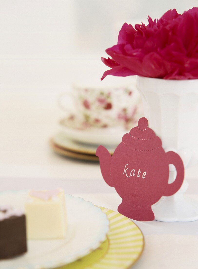 A place card in the shape of a teapot