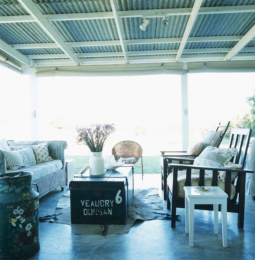 Couch, chairs and trunk used as coffee table