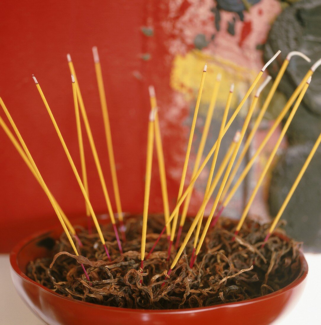 Joss sticks in a dish