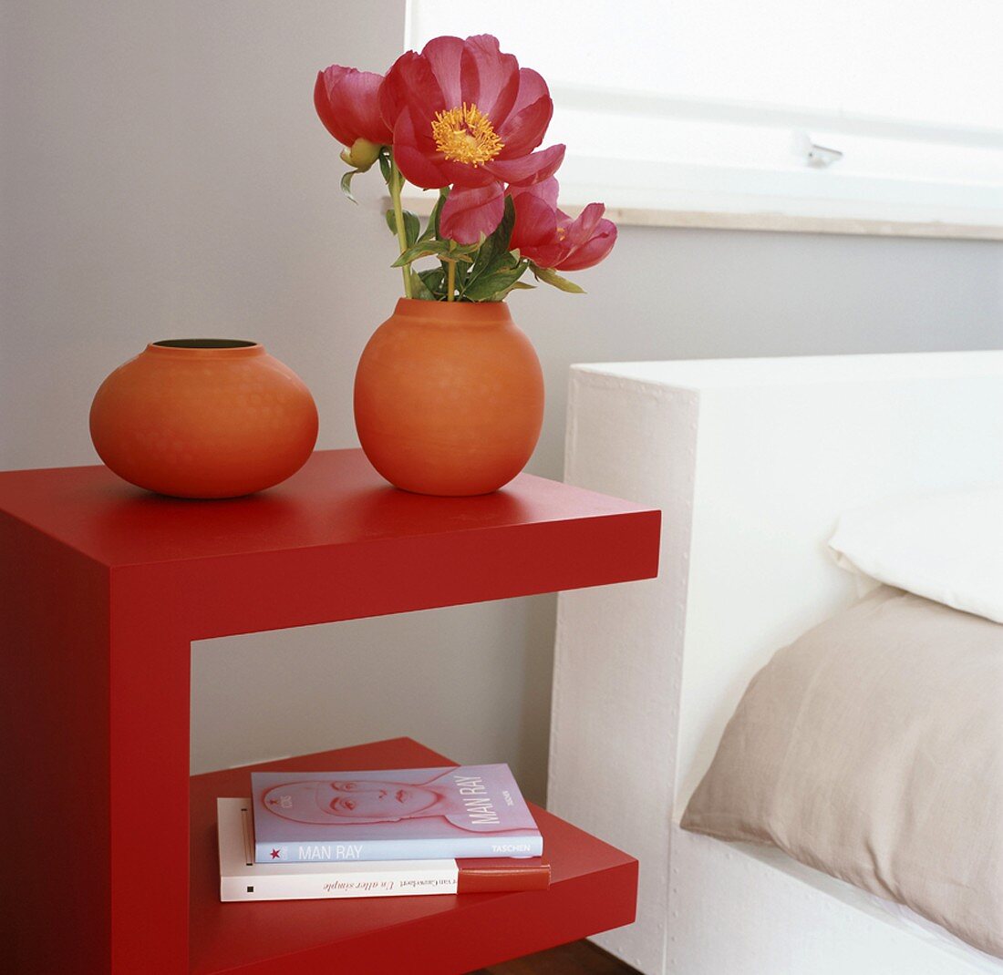 Flowers on bedside table in bedroom