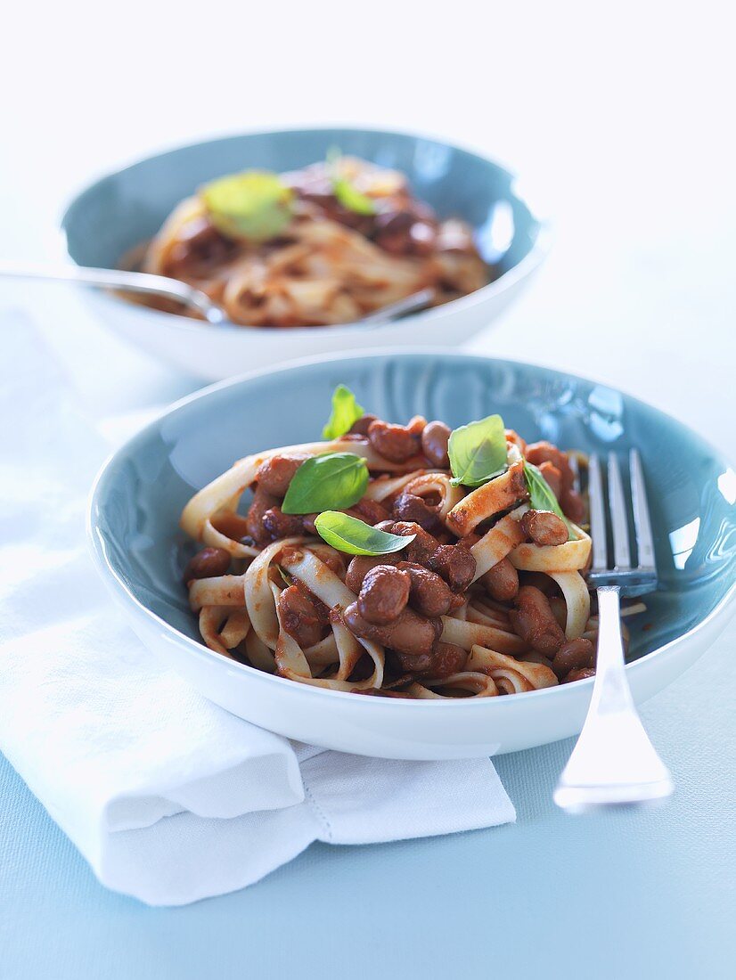 Ribbon pasta with tomatoes, beans and basil