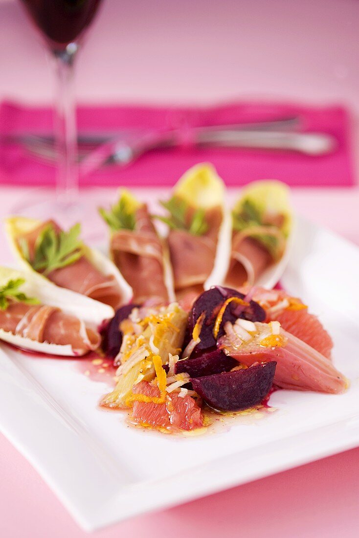 Ham in chicory with rhubarb, beetroot and grapefruit salad