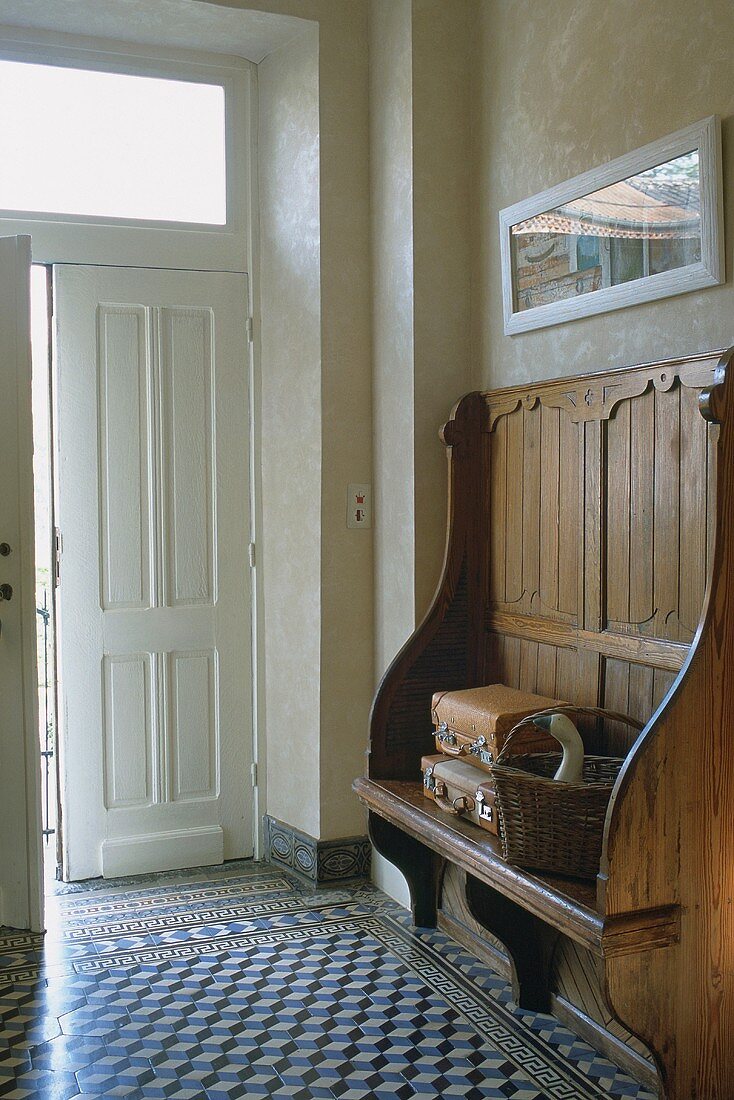 A hallway with a wooden bench