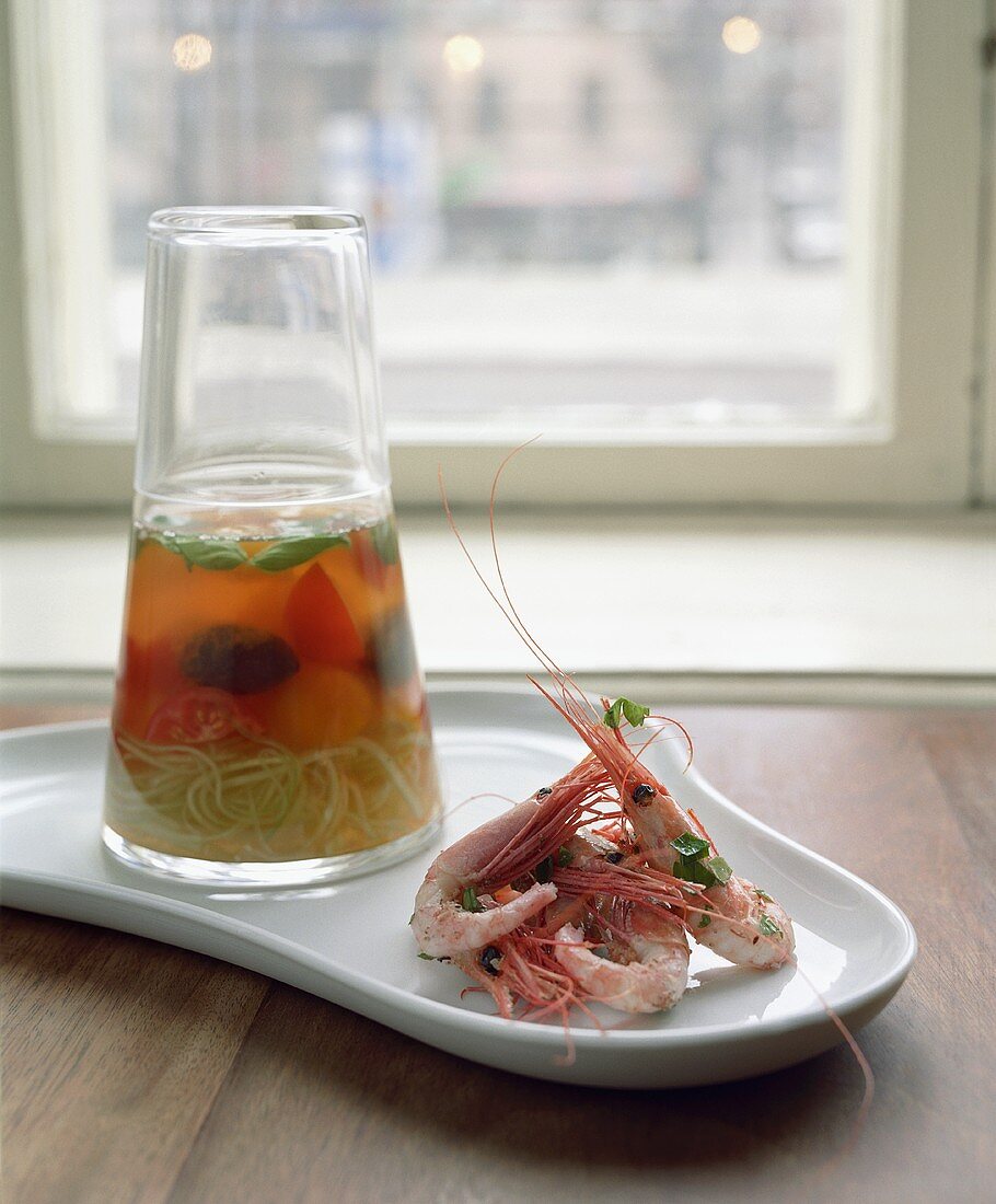 Prawns and spaghetti with tomato sauce in a glass