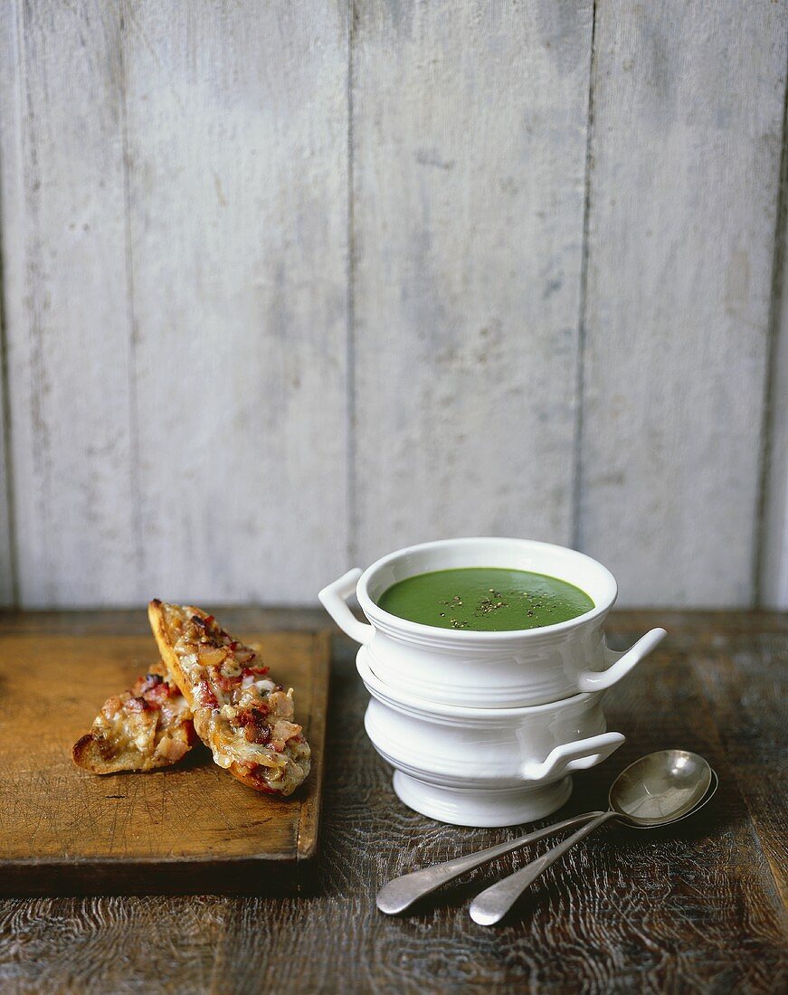 Spinach and watercress soup with cheese on toast
