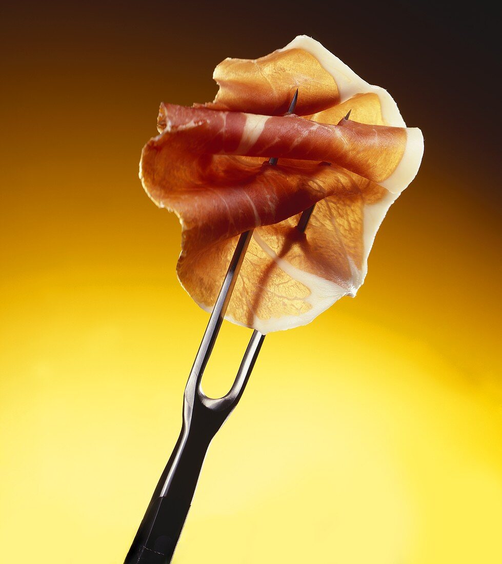 Smoked ham on carving fork
