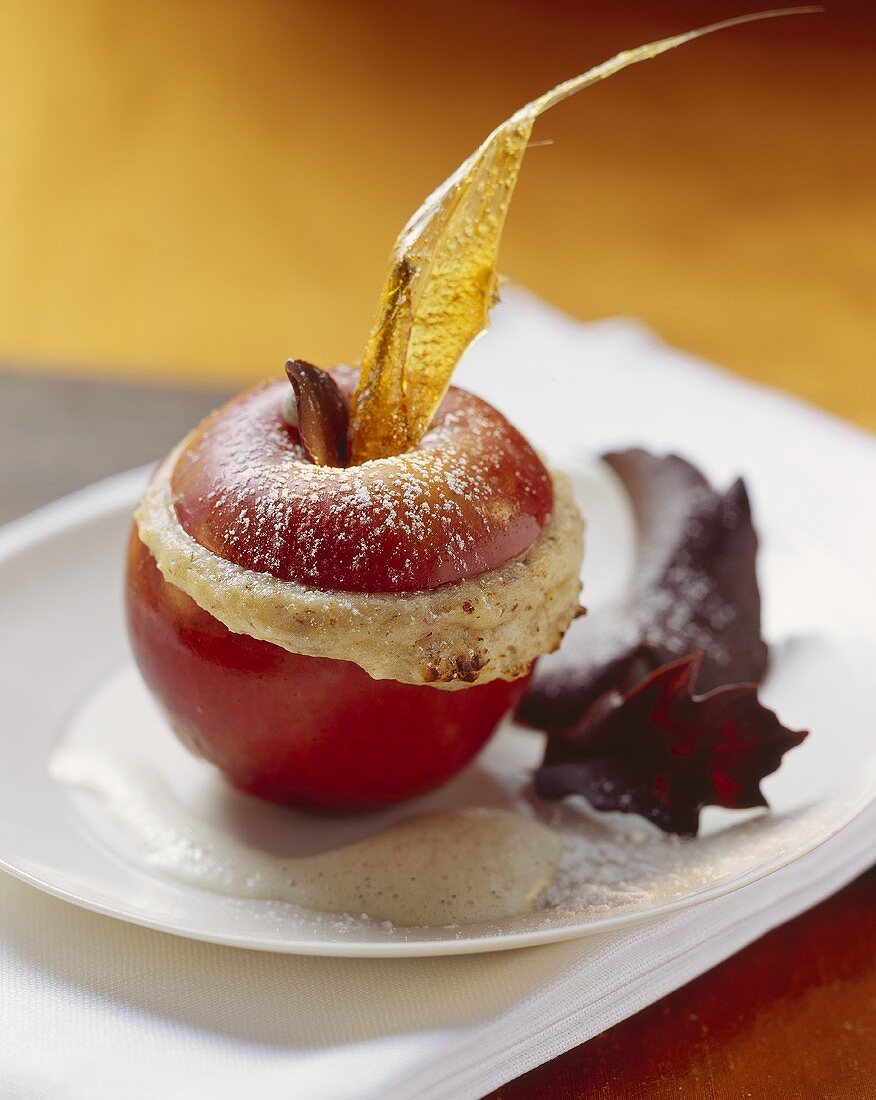 Stuffed baked apple with chocolate leaves