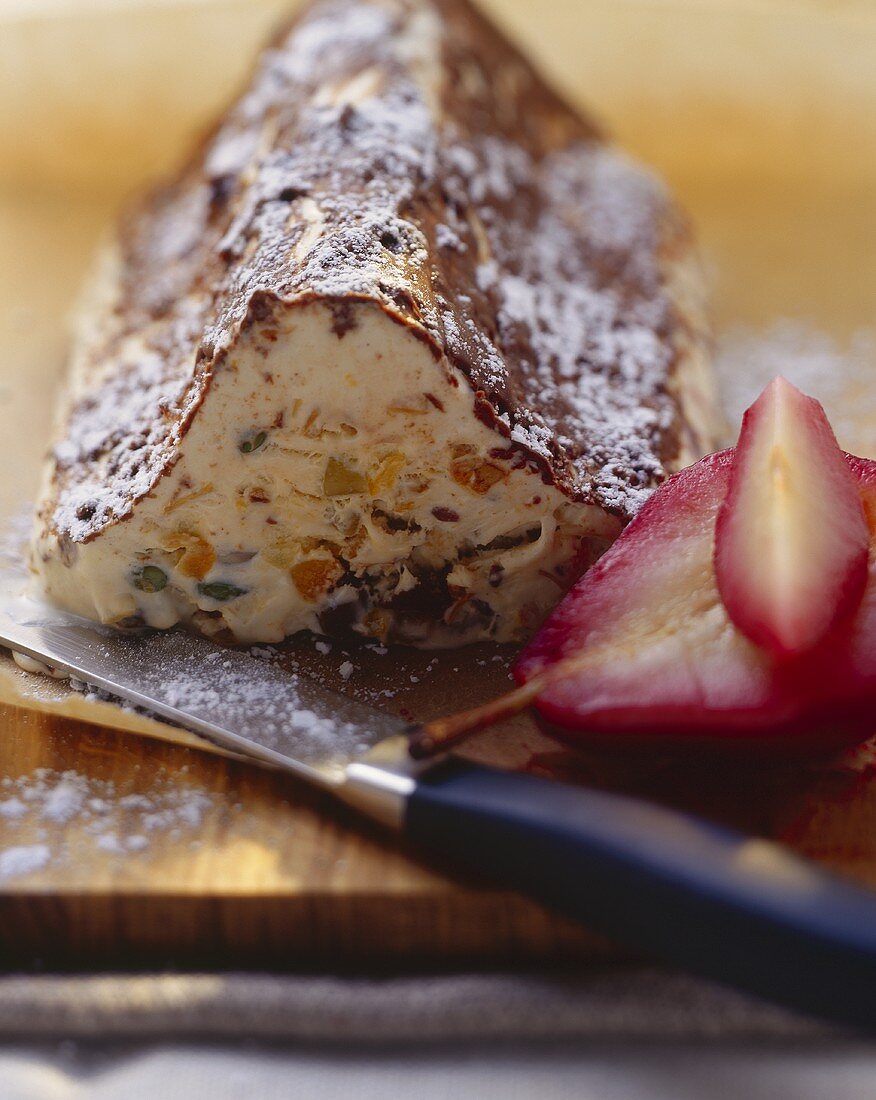 Frozen stollen (German Christmas loaf) with red wine pears