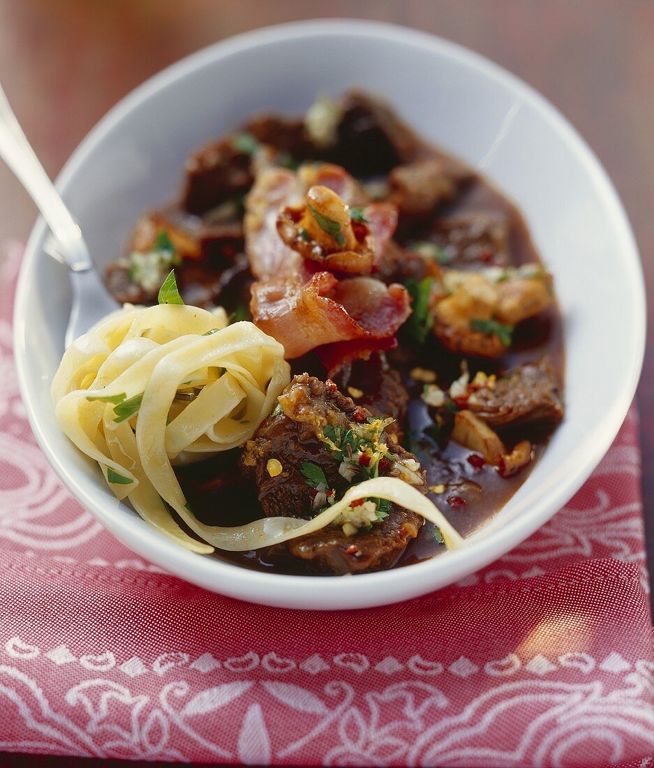 Beef cooked in beer with bacon and tagliatelle (Salzburg)