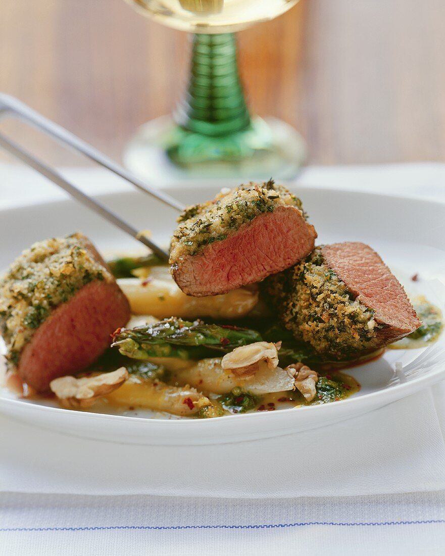 Loin of lamb with herb crust on asparagus