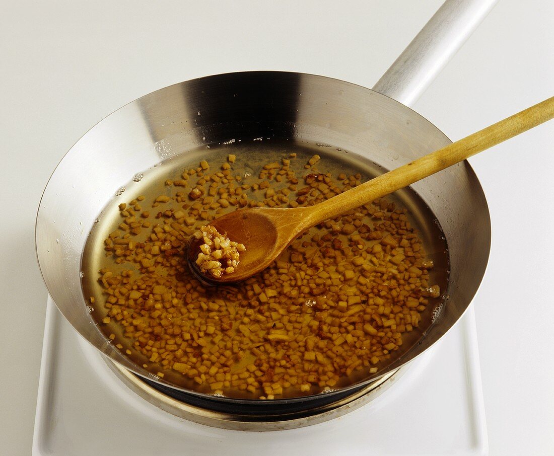 Rendering fat in a frying pan