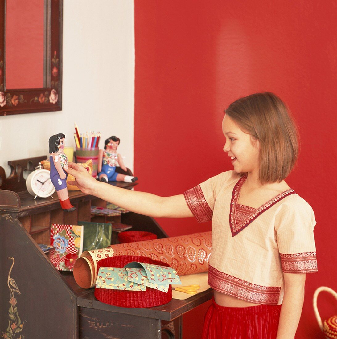 Girl playing with rag dolls