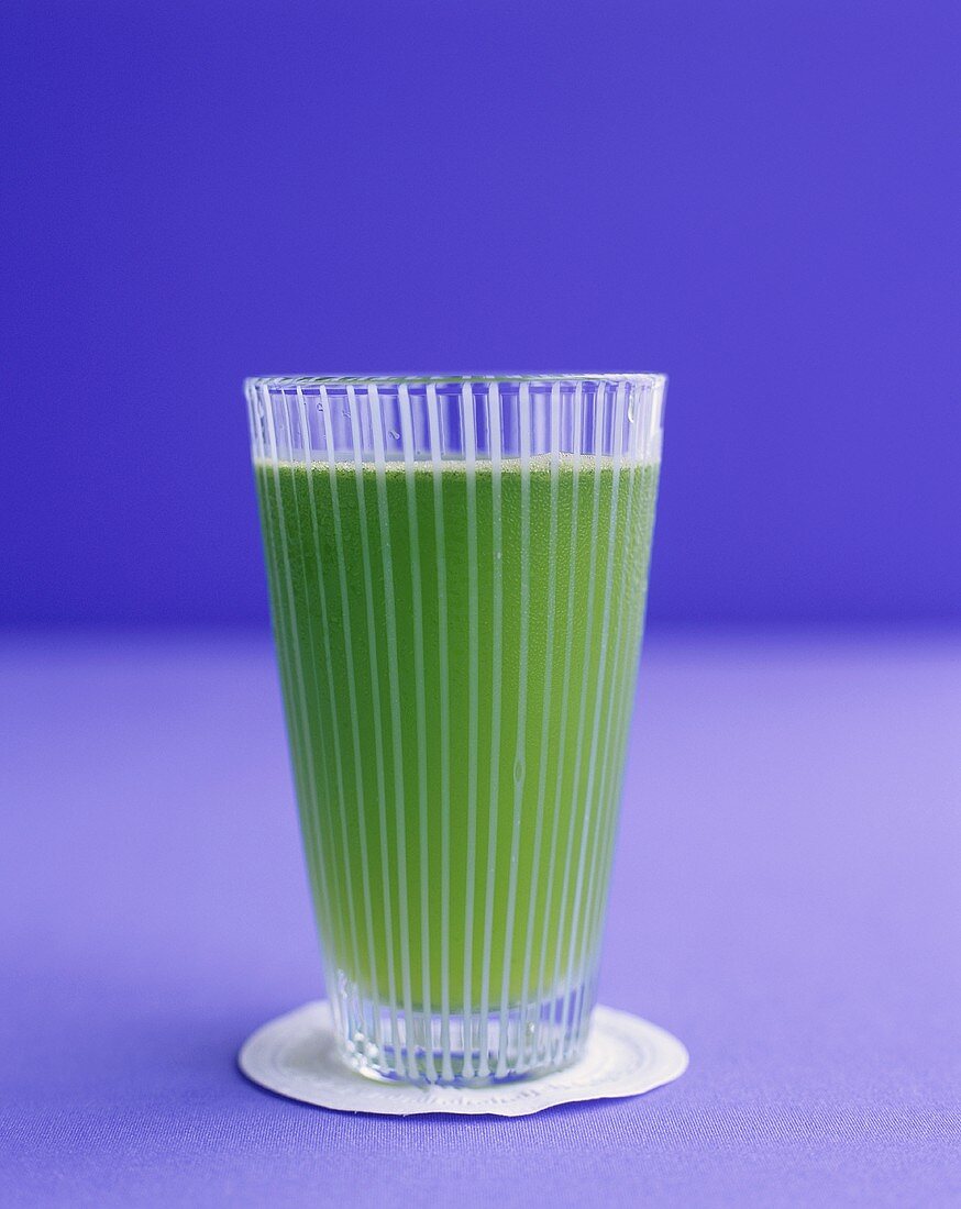 A glass of wheatgrass juice