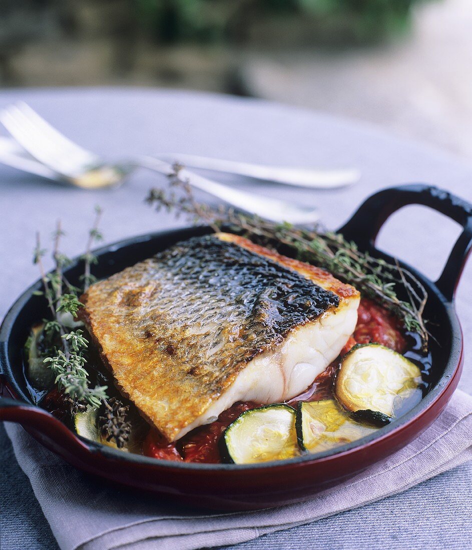 Sea bass on Mediterranean vegetables with olive oil