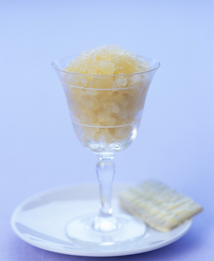 White tea sorbet in glass with white chocolate biscuit