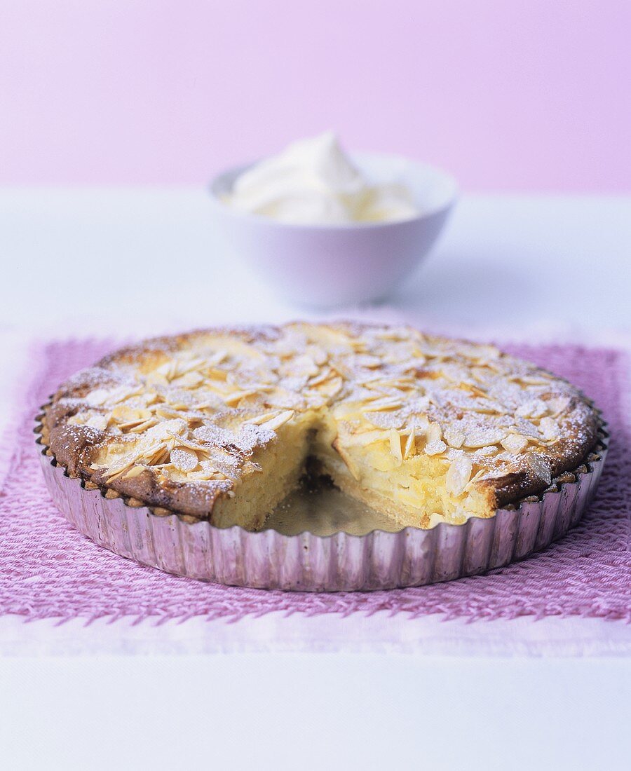 Apple and almond tart with whipped cream