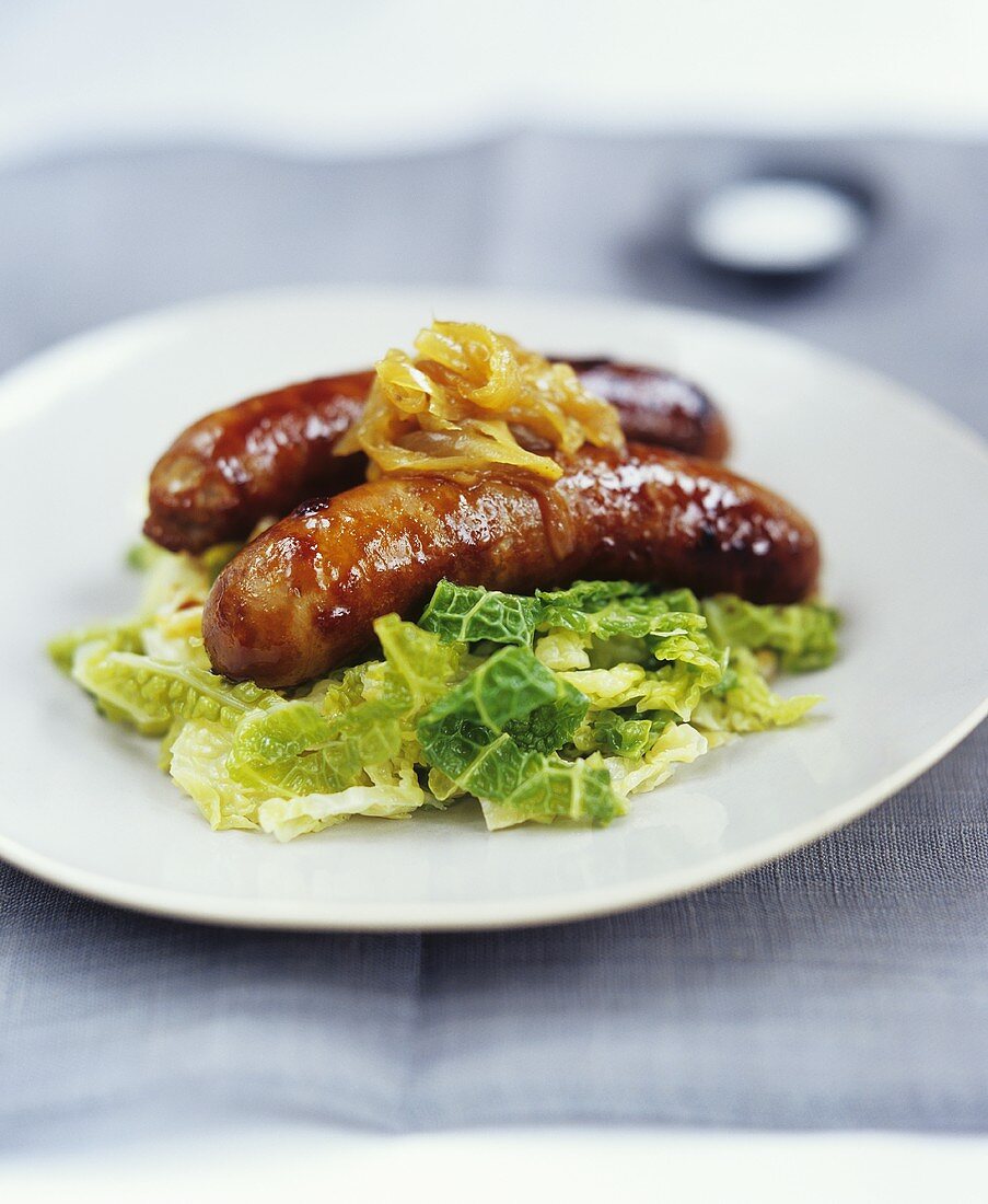 Two sausages on savoy cabbage