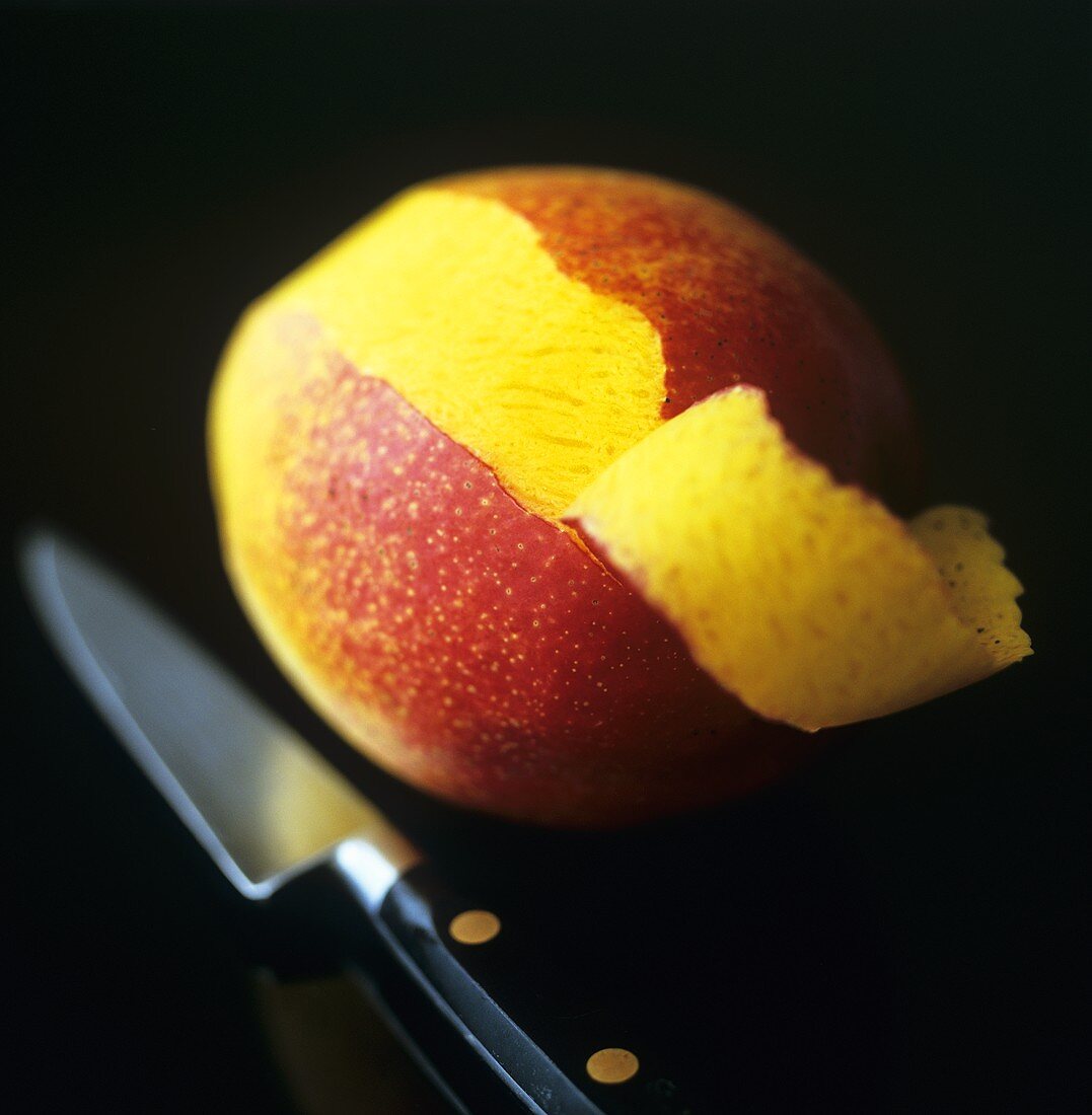 Mango, partly peeled