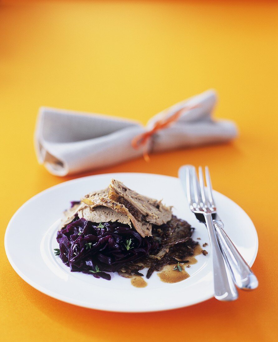 Slow-cooked duck with five-spice powder on red cabbage