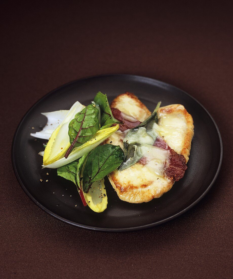 Turkey escalope with bacon, melted cheese and sage