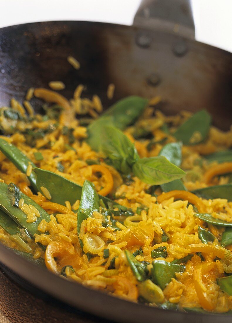 Stir-fried curried coconut rice with mangetout