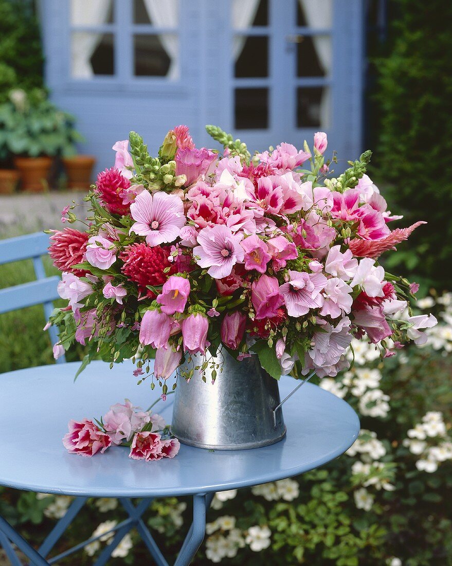 Pink flowers in zinc jug