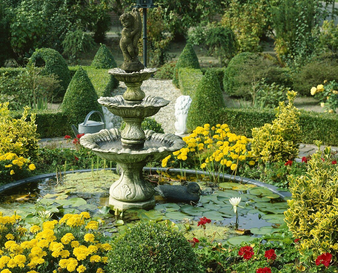 Park with pond and summer flowers