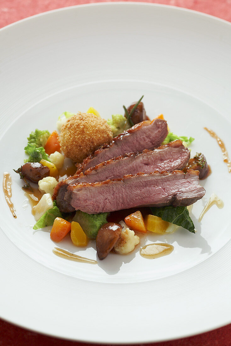 Barbary duck breast with spiced skin, vegetables & dumpling