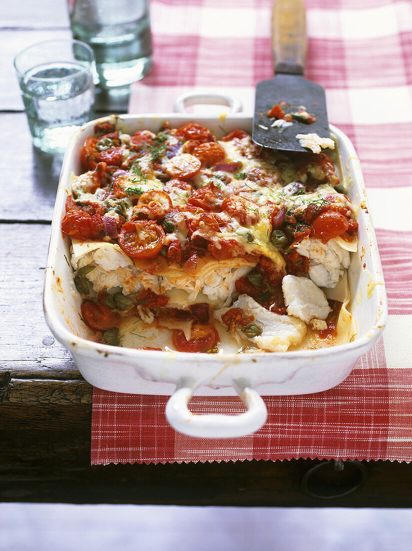 Fish lasagne with capers and cherry tomatoes