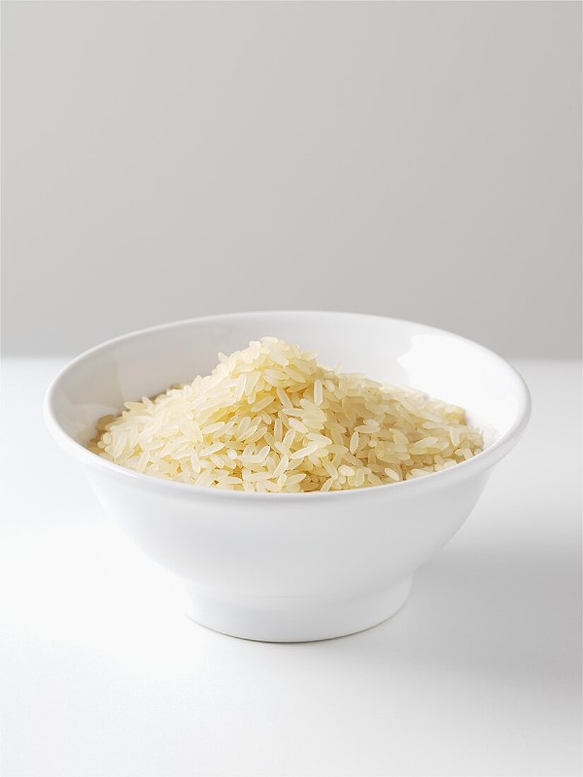 Uncooked rice in a small bowl