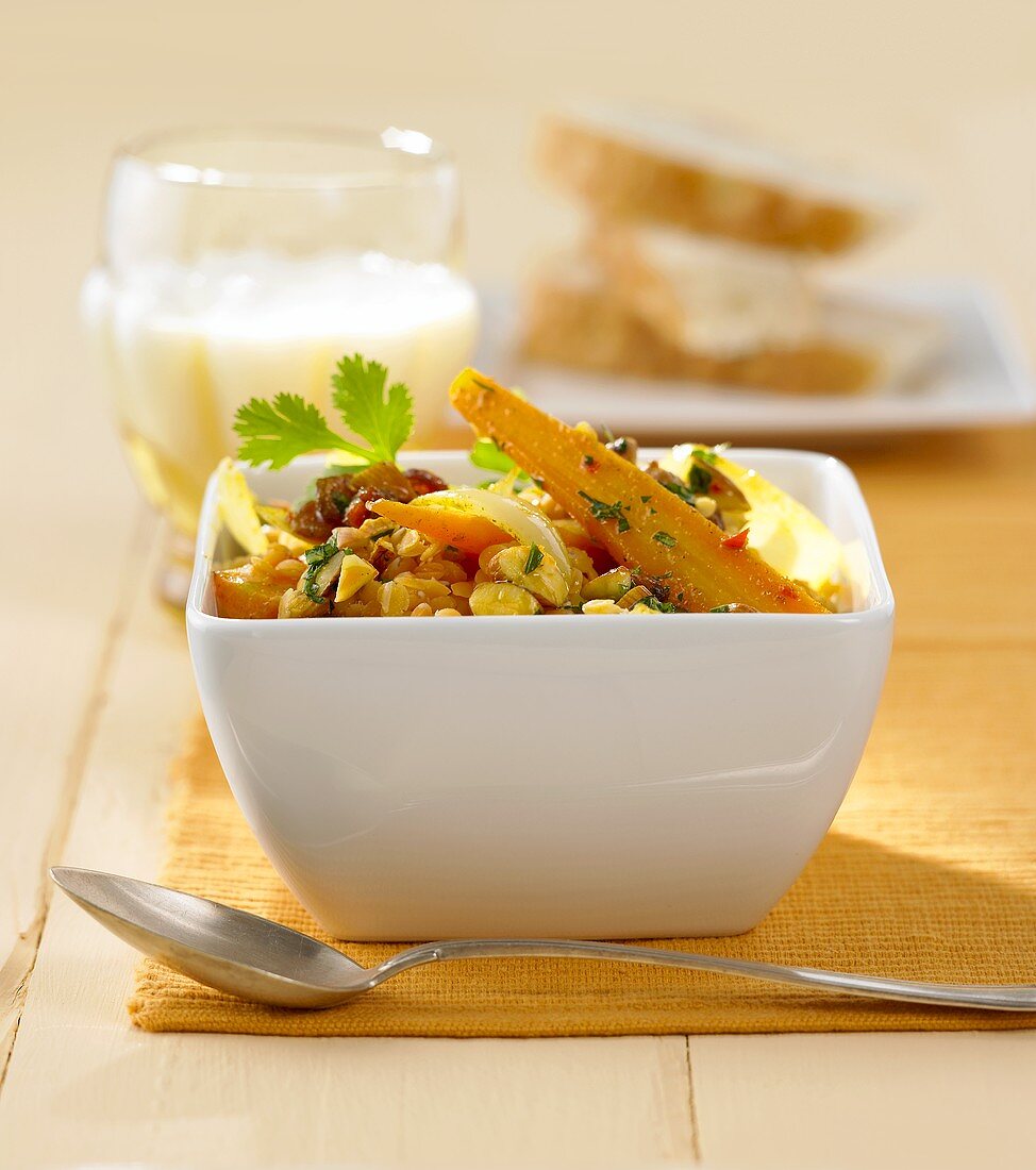 Carrot curry with red lentils, raisins and almonds