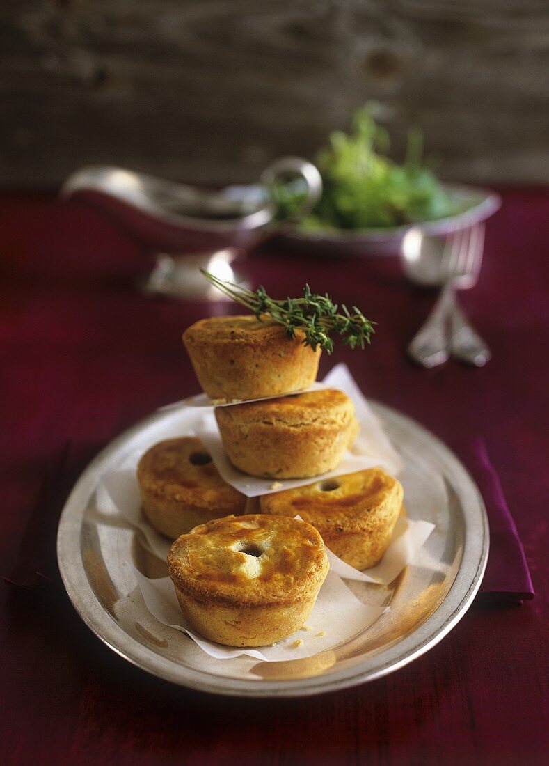 Small meat pies with sauce-boat of Cumberland sauce