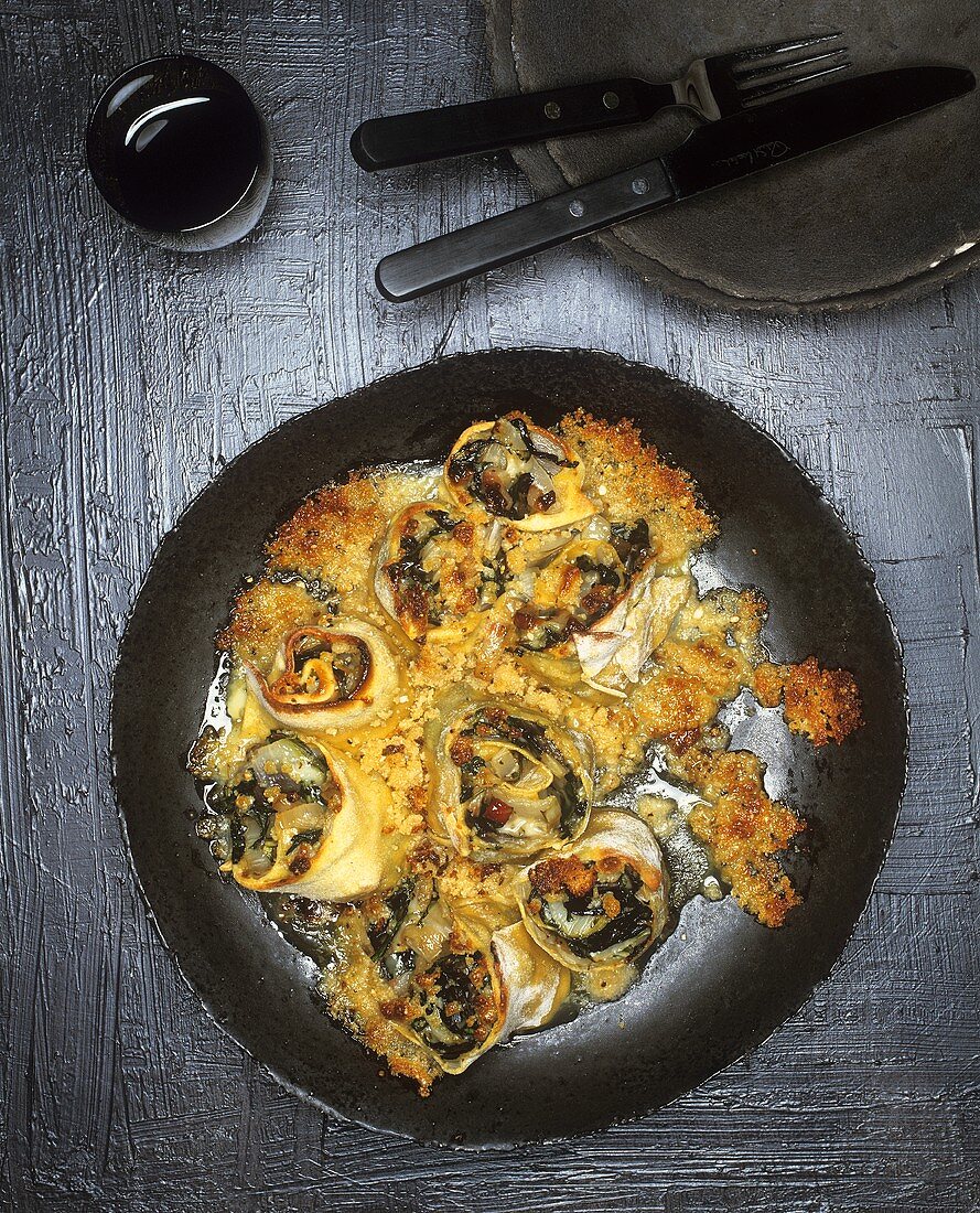 Baked pasta rolls with chard filling
