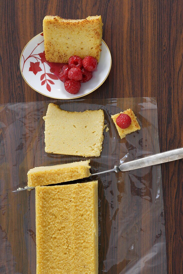 Fried sweet couscous slices with raspberries