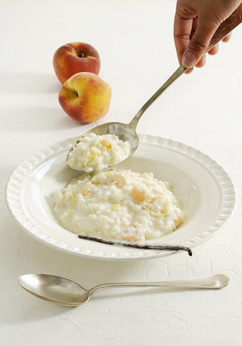 Rice pudding with peach, vanilla and lemon zest