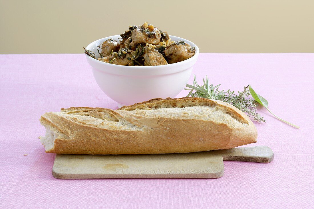 Pork ragout with herbs, served with baguette