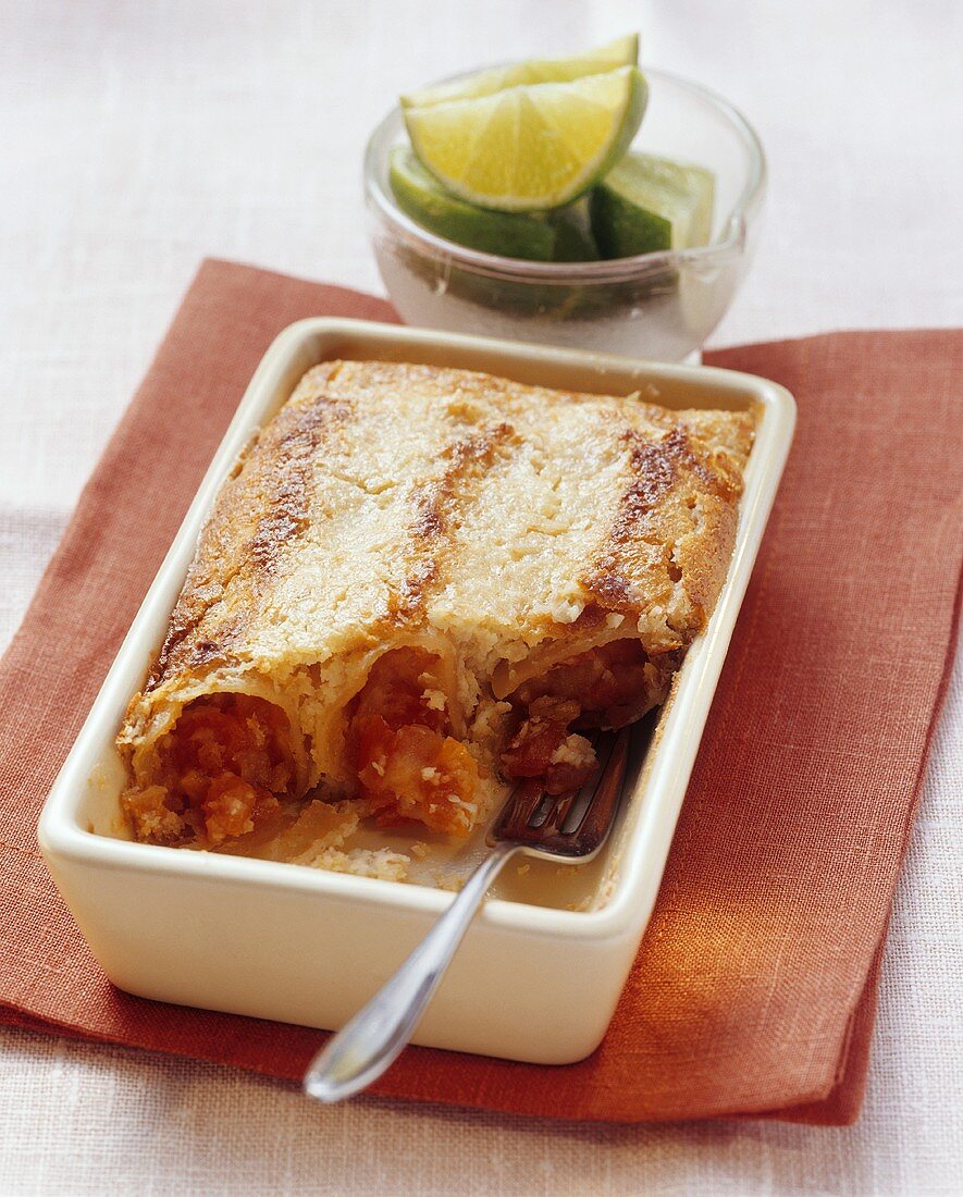 Sweet papaya-filled cannelloni with coconut flakes