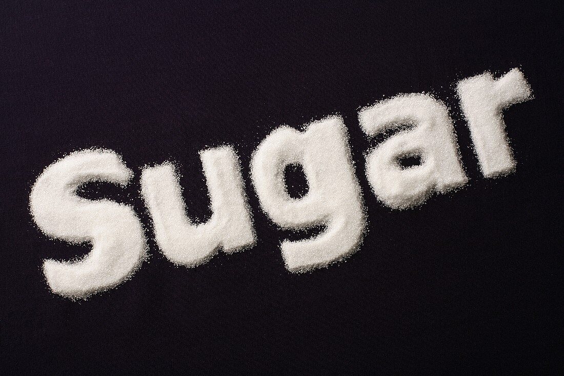The word 'Sugar' written in sugar