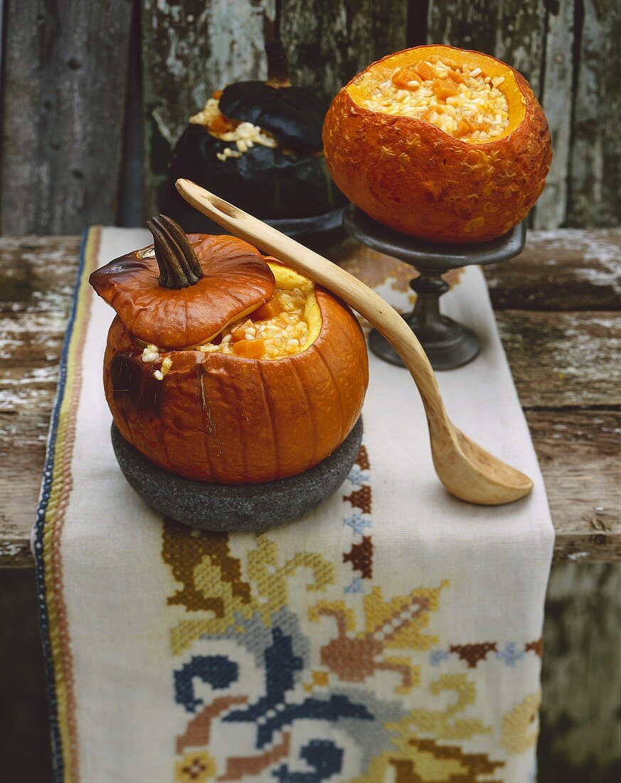 Pumpkin risotto served in hollowed-out pumpkins