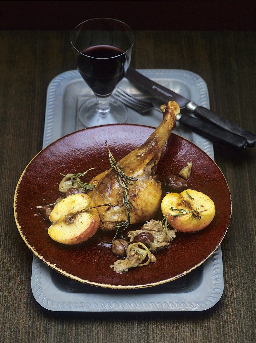Goose leg with chestnuts and apples