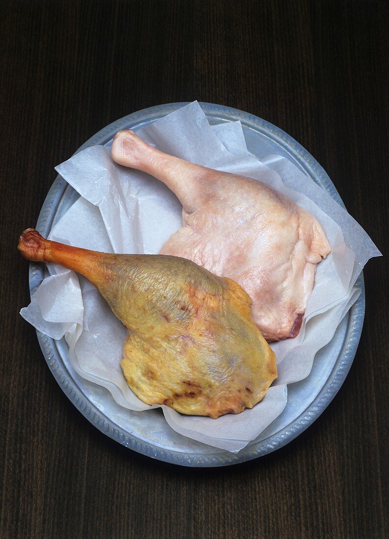 Raw and roast goose legs