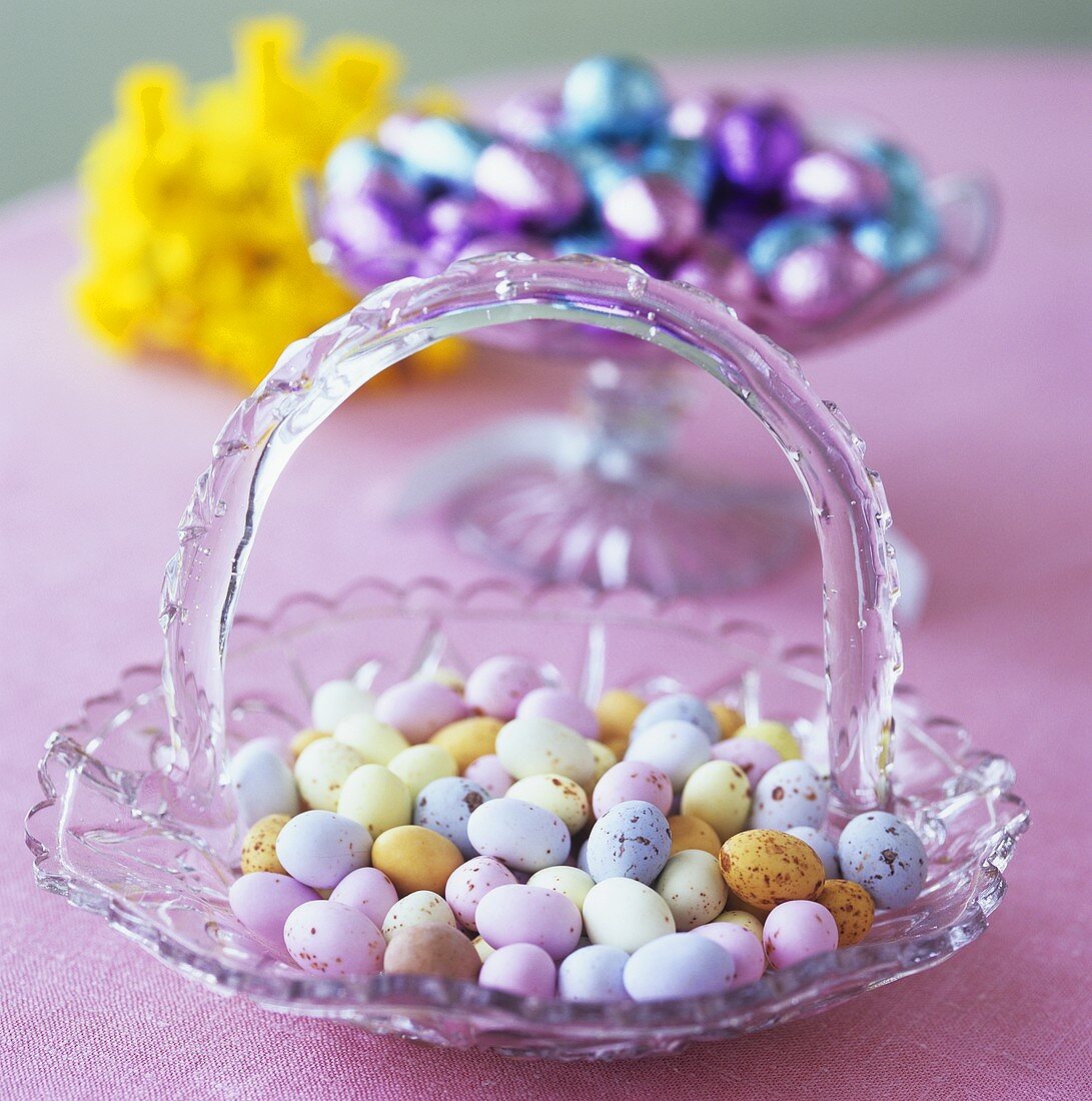 Easter sweets: small coloured Eastered eggs in glass dish