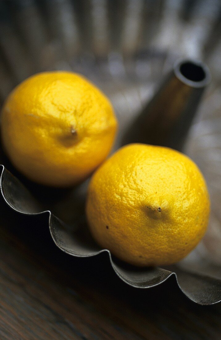 Two lemons in a baking tin