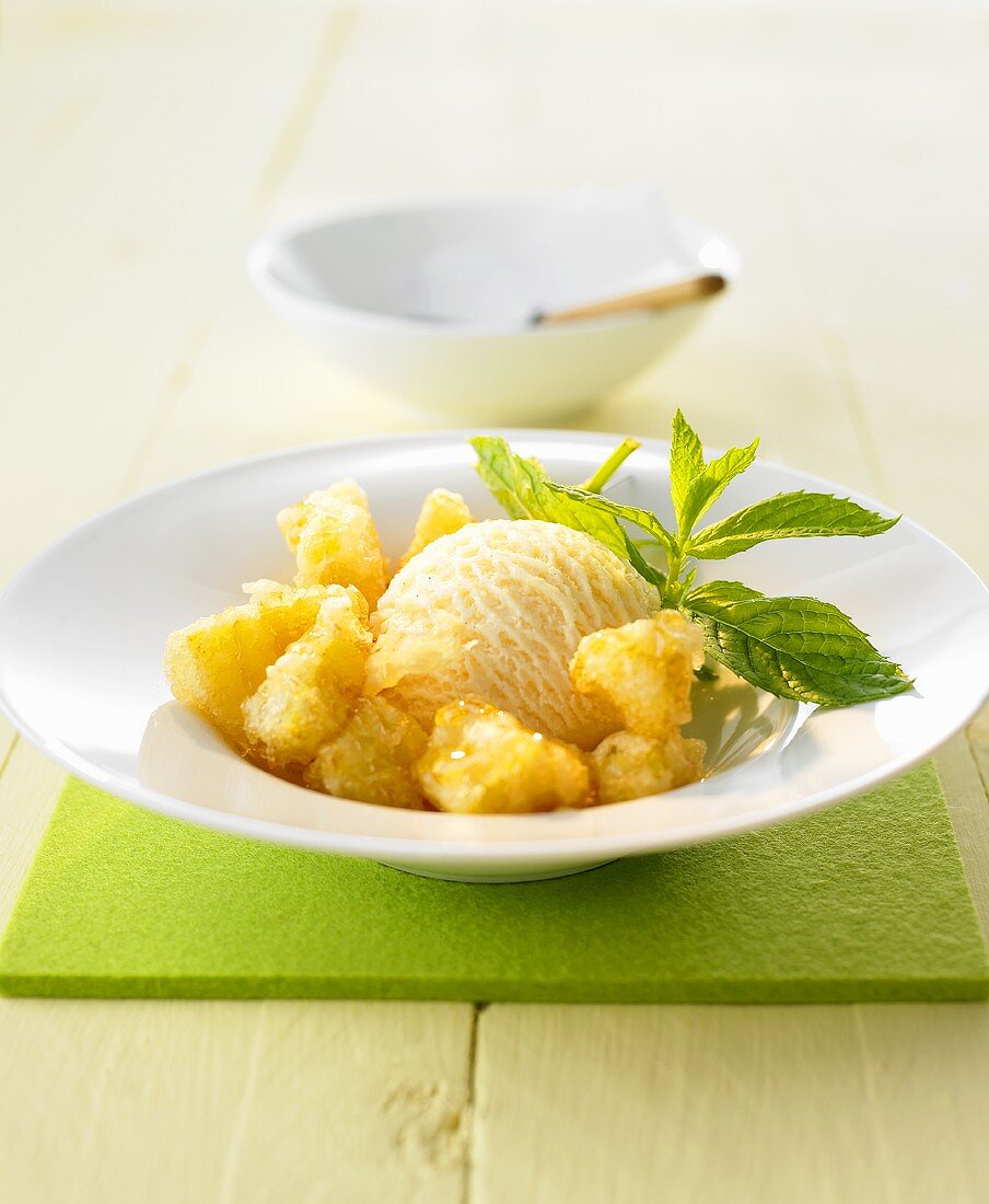 Pineapple fritters with honey and ice cream (Thailand)