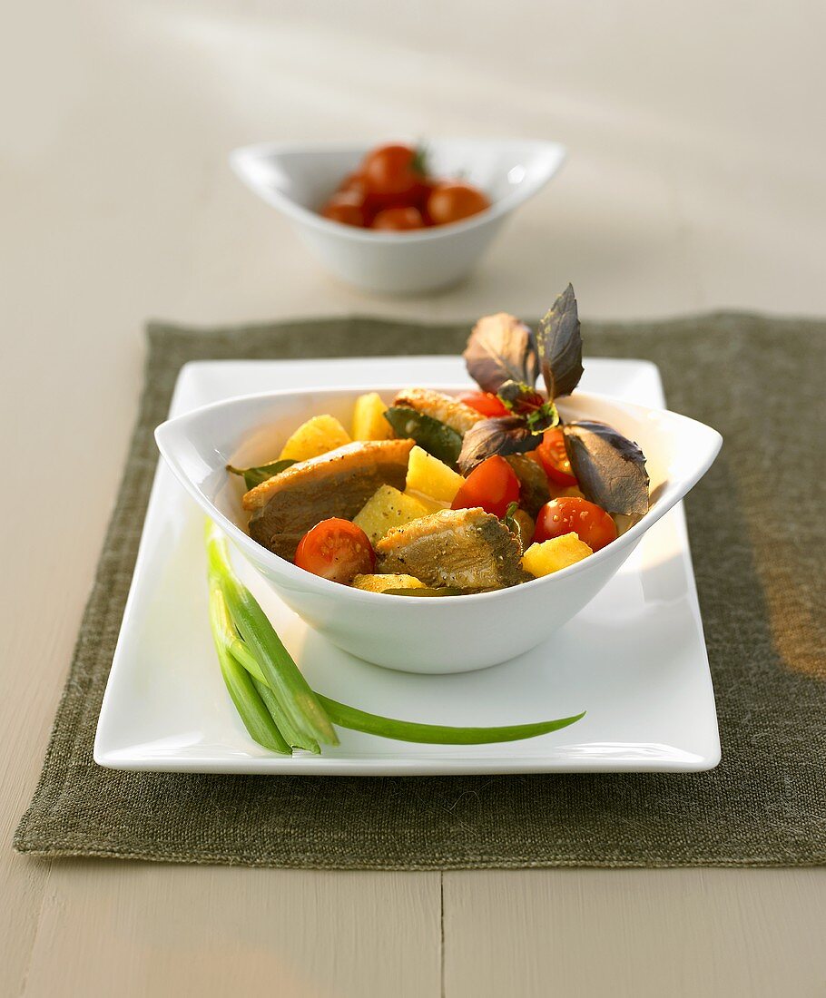 Red duck curry with pineapple and cherry tomatoes