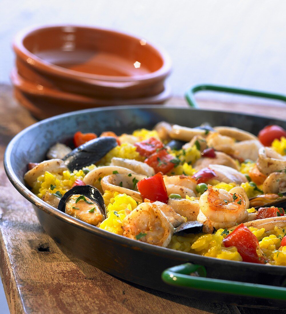 Seafood paella in a paella pan